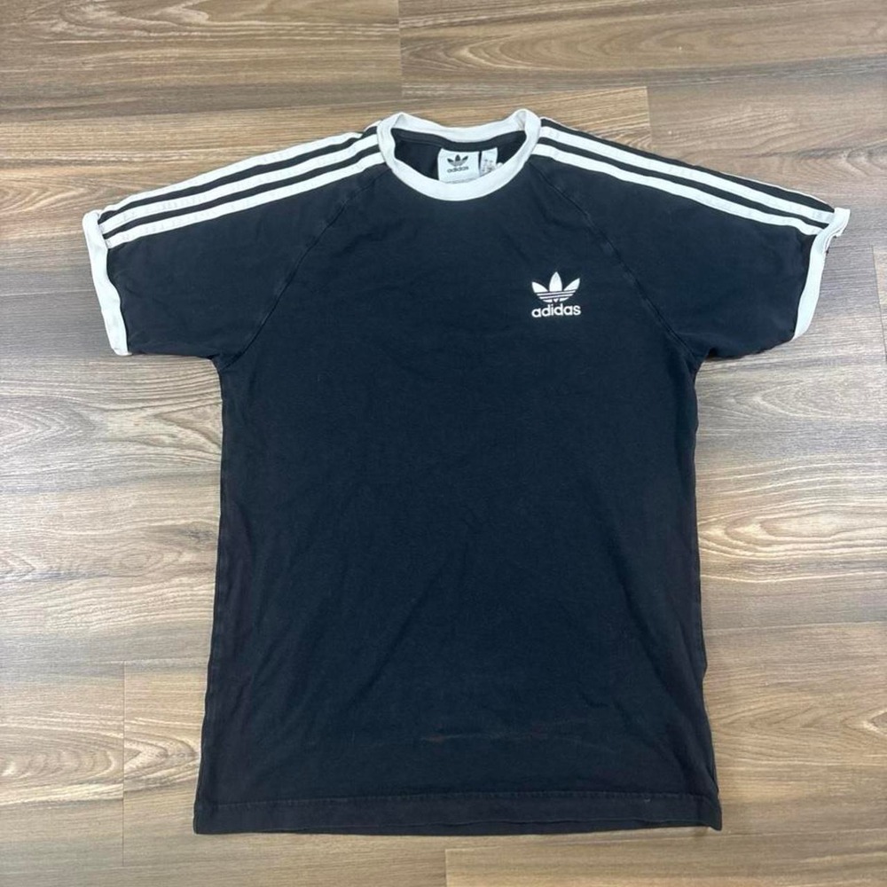 Adidas Originals black t-shirt with white stripes on shoulders and sleeves